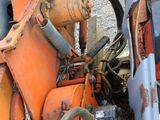 a close up view of a tractor engine and its hoses