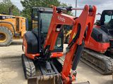two excavators that are parked in the dirt