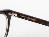 a close up of a pair of glasses on a white surface