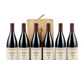 six bottles of red wine in a wooden box