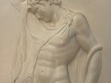 a statue of a man with a towel on his head
