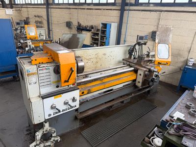a machine that is working in a factory with a lot of tools