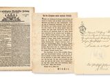 un vieux livre ouvert sur une page où figure la photo d'un homme et d'une femme