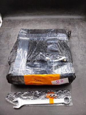 a plastic bag with a pair of wrenches on it