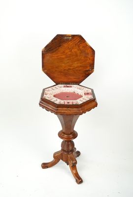 a small wooden table with a clock on top of it