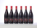 six bottles of red wine lined up in a row