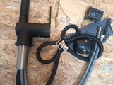 a black hose and a black hose on a wooden floor