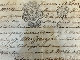 an old document with writing on it sitting on a table