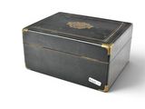 a black box with gold trim and a lion on it