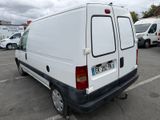 a white van that is parked in a parking lot