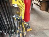 a yellow machine that is sitting next to a red fire hydrant