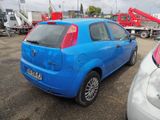 a blue car that is parked in a parking lot