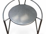 an image of a metal chair with a round seat on a white background