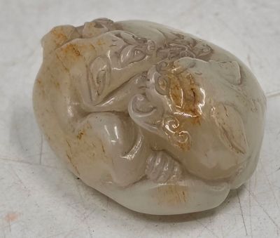 a picture of a white stone with a carving on it