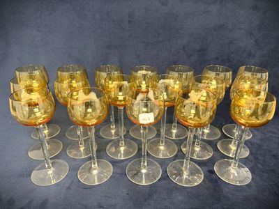 a lot of wine glasses that are sitting on a table