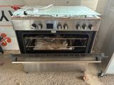 a silver oven with a bag of food inside of it