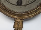 a clock that is hanging on the wall in the room