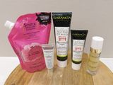 a wooden board with various skin care products on it