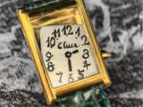 an image of a close up of a wrist watch on a cloth