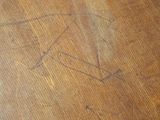 a cat that is sitting on top of a wooden table