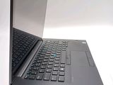 a laptop with a black keyboard on a white surface