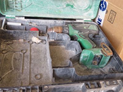 a tool box with tools in it sitting on the floor