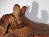 a statue of a person laying on top of a pillow