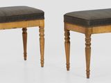 pair of antique stools with upholstered seat and turned legs