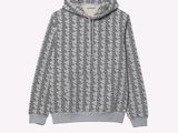 the hoodie is made of a grey and white geometric pattern