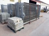 many stacks of concrete blocks on a pallet in front of a building