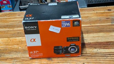 a box that has a camera inside of it on a table