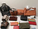 a lot of purses that are sitting on a table