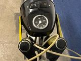 a close up of a motorcycle with a clock on the handlebars