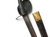 a close up of a knife and a sheath on a white surface
