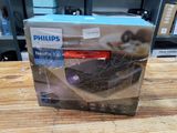 packaging of a philips dishwasher sitting on a wooden table