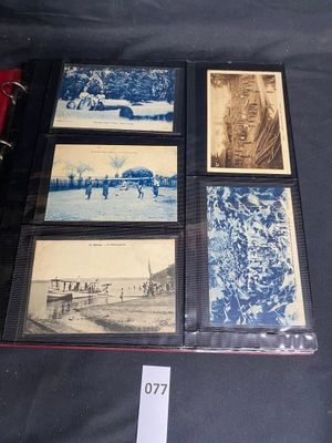 a collection of old photographs on display on a table