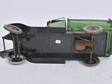 a toy truck that is sitting on a white surface