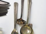 many different types of spoons and utensils on the table