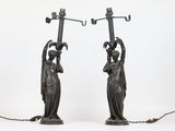 pair of art nouveau style bronze table lamps in the manner of person