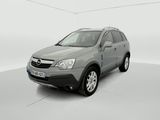 the grey car is parked in a white room with a white floor