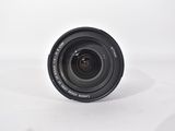 the camera lens is sitting on a white surface with a white background