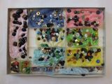 a box filled with buttons and buttons on a table
