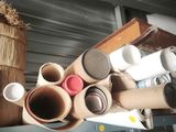 many rolls of toilet paper on a shelf next to a basket
