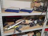a lot of tools on the shelves in the room