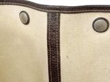 a close up of a bag with buttons on it