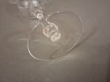 two empty wine glasses sitting on a table