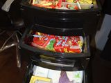 a picture of a three tiered cart with snacks in it