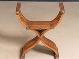 an image of a small wooden stool on a beige floor
