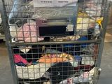 a metal cart with a lot of clothes in it