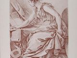 an old book with a drawing of a woman sitting at a desk